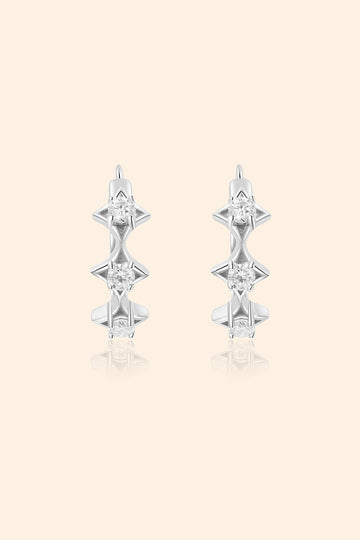 Dainty silver starlight huggie hoop earrings with sparkling moissanites by LIRAE