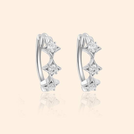 Dainty silver starlight huggie hoop earrings with sparkling moissanites by LIRAE