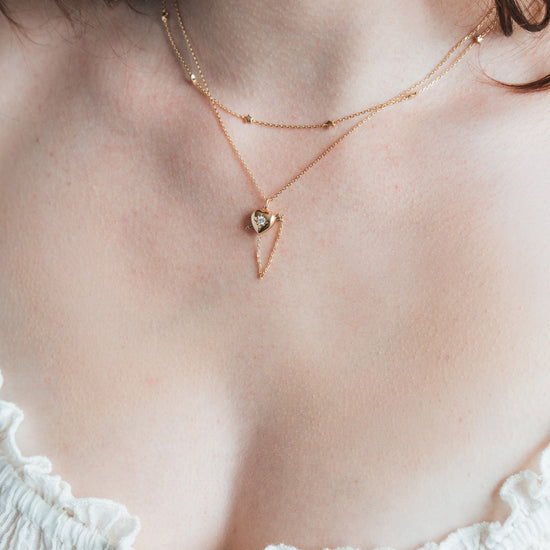 Dainty gold star necklace with scattered star charms