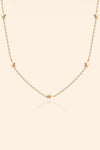 Dainty gold star necklace with scattered star charms
