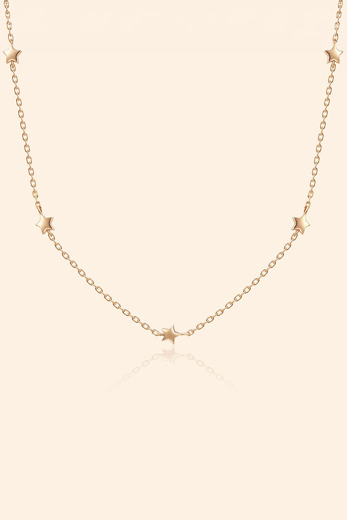 Dainty gold star necklace with scattered star charms