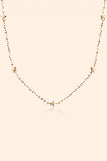 Dainty gold star necklace with scattered star charms