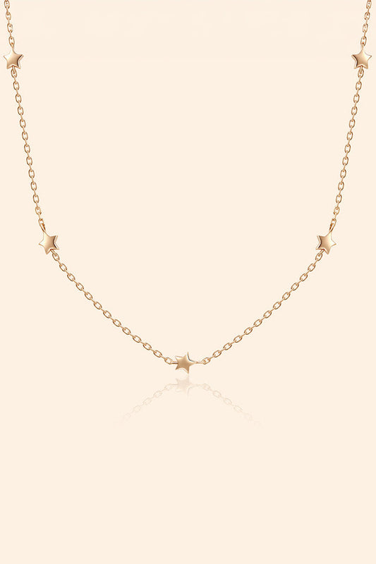 Dainty gold star necklace with scattered star charms
