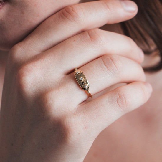 Vintage-inspired 14k gold plated triple star signet ring with diamond accents, handcrafted celestial talisman ring by LIRAE.