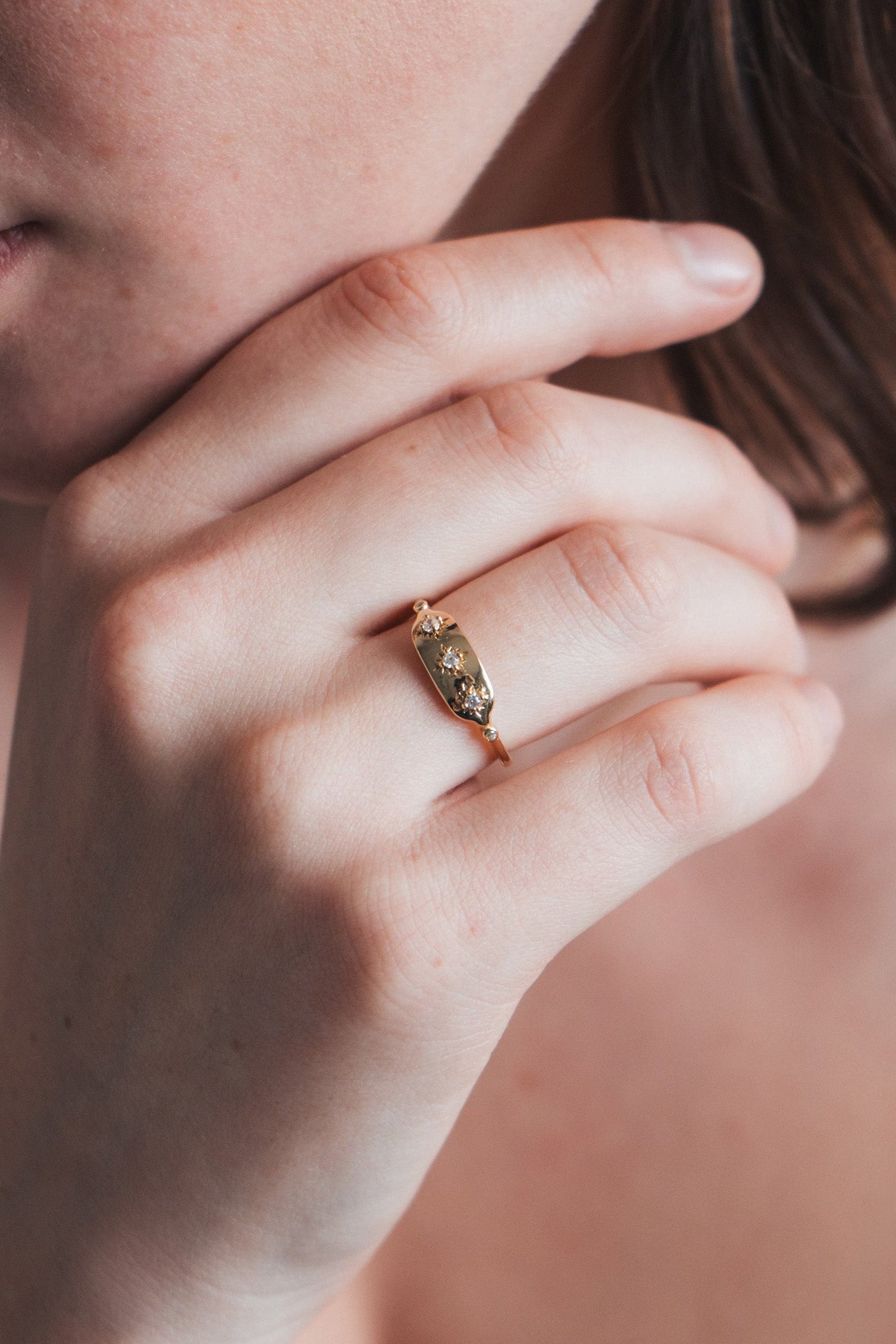 Vintage-inspired 14k gold plated triple star signet ring with diamond accents, handcrafted celestial talisman ring by LIRAE.