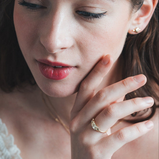Vintage-inspired 14k gold plated triple star signet ring with diamond accents, handcrafted celestial talisman ring by LIRAE.