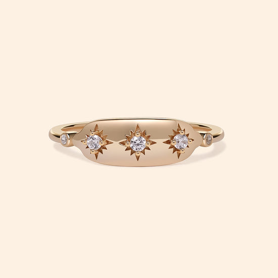 Vintage-inspired 14k gold plated triple star signet ring with diamond accents, handcrafted celestial talisman ring by LIRAE.
