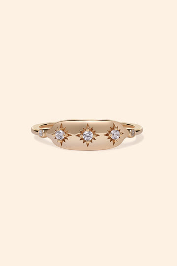 Vintage-inspired 14k gold plated triple star signet ring with diamond accents, handcrafted celestial talisman ring by LIRAE.