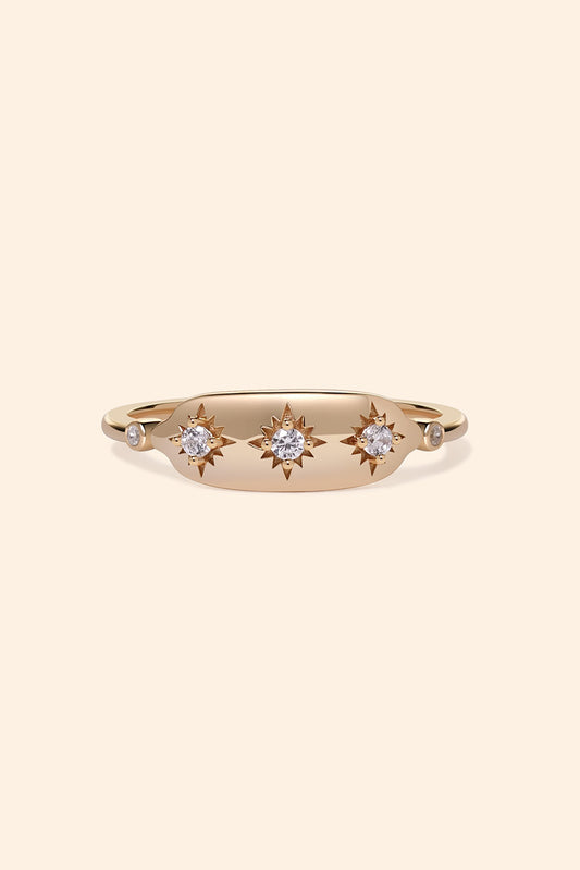 Vintage-inspired 14k gold plated triple star signet ring with diamond accents, handcrafted celestial talisman ring by LIRAE.