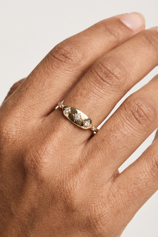 Vintage-inspired 14k gold plated triple star signet ring with diamond accents, handcrafted celestial talisman ring by LIRAE.