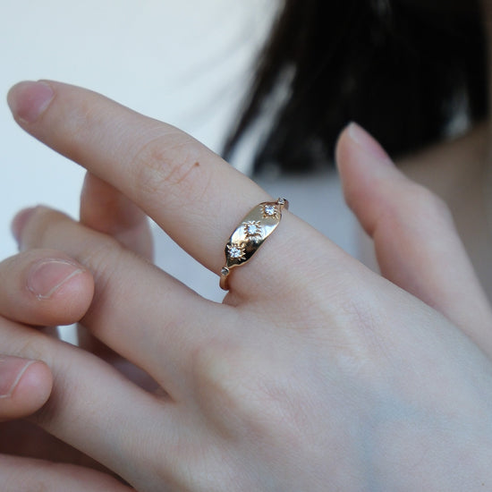 Vintage-inspired 14k gold plated triple star signet ring with diamond accents, handcrafted celestial talisman ring by LIRAE.
