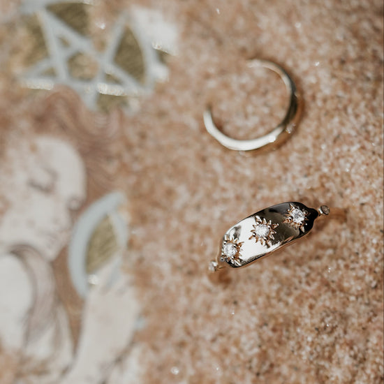 Vintage-inspired 14k gold plated triple star signet ring with diamond accents, handcrafted celestial talisman ring by LIRAE.