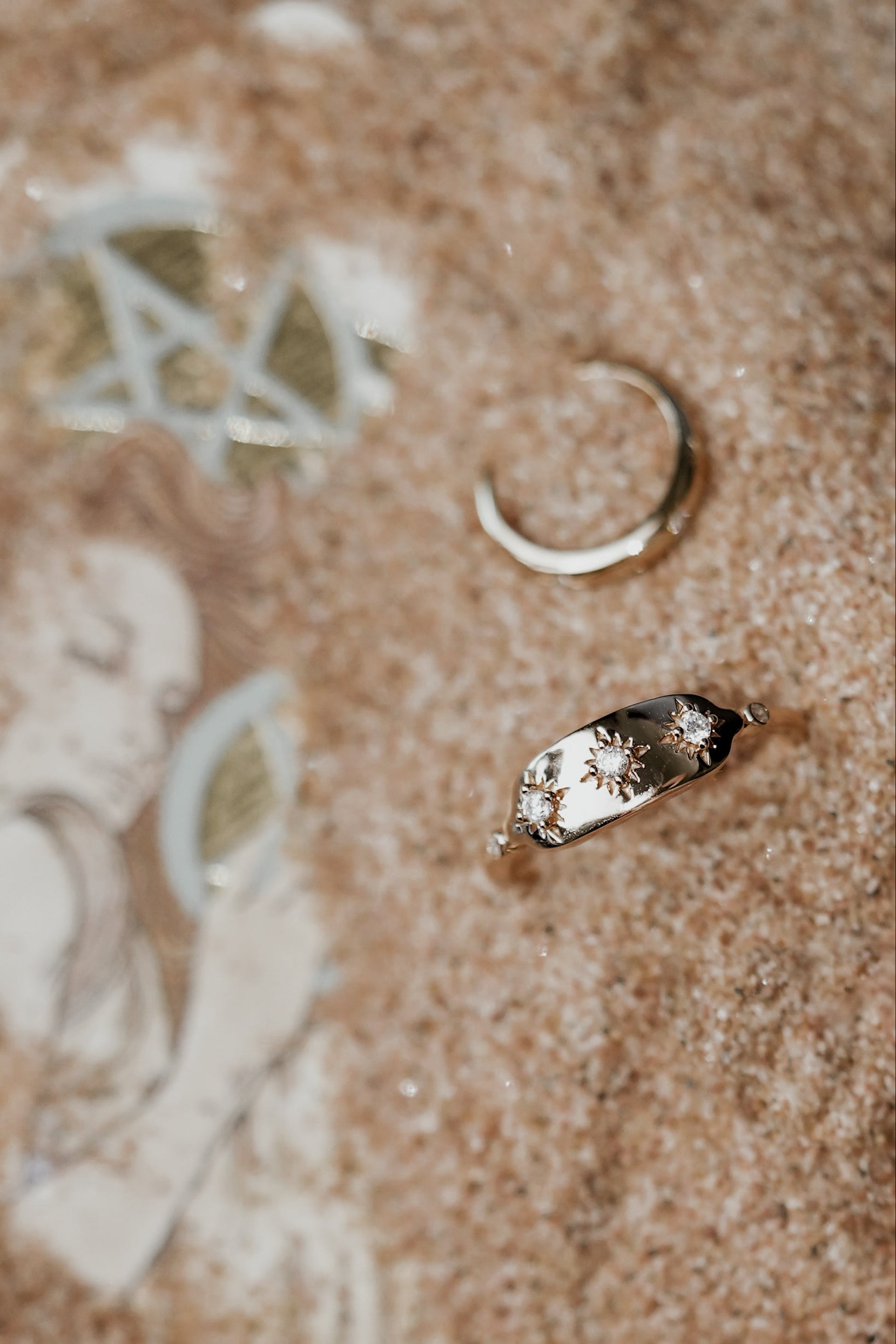 Vintage-inspired 14k gold plated triple star signet ring with diamond accents, handcrafted celestial talisman ring by LIRAE.