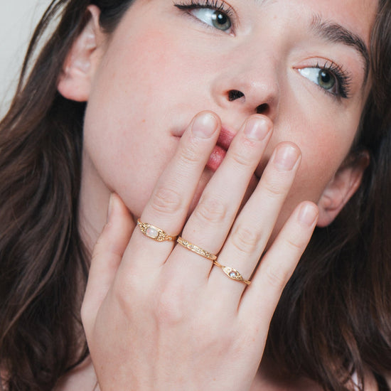 Intricately engraved 14k gold plated filigree band with a center iridescent opal, vintage-inspired scrollwork wedding or stacking ring by LIRAE.