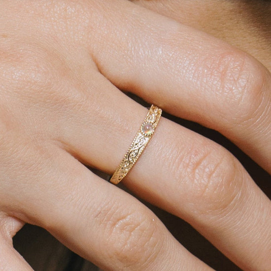Intricately engraved 14k gold plated filigree band with a center iridescent opal, vintage-inspired scrollwork wedding or stacking ring by LIRAE.
