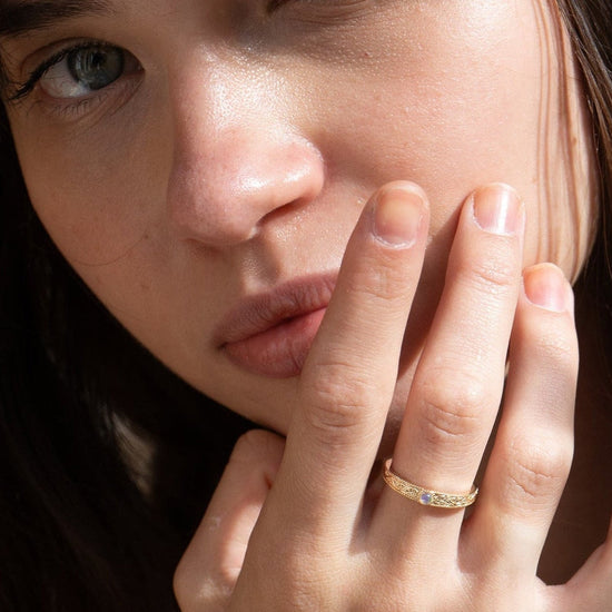 Intricately engraved 14k gold plated filigree band with a center iridescent opal, vintage-inspired scrollwork wedding or stacking ring by LIRAE.