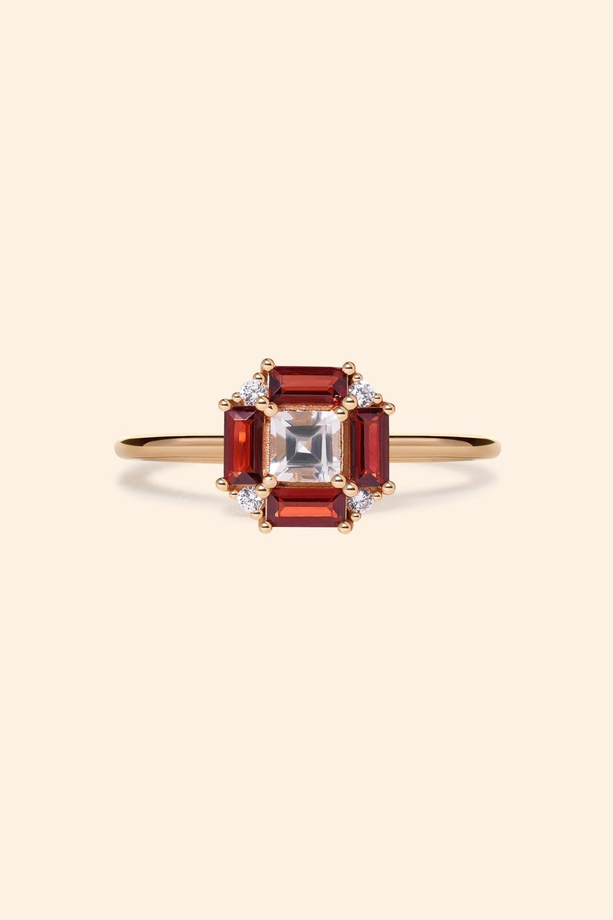 LIRAE vintage Art Deco ring with an octagon halo of red garnet baguettes and a white topaz center stone, geometric gold statement ring for women.