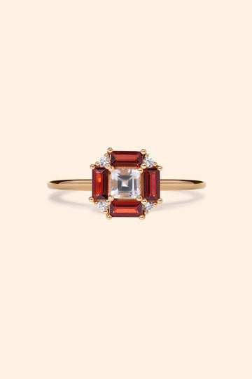 LIRAE vintage Art Deco ring with an octagon halo of red garnet baguettes and a white topaz center stone, geometric gold statement ring for women.