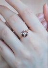 LIRAE vintage Art Deco ring with an octagon halo of red garnet baguettes and a white topaz center stone, geometric gold statement ring for women.