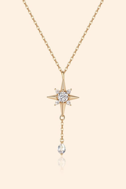 Gold north star necklace with a dangle moonstone.