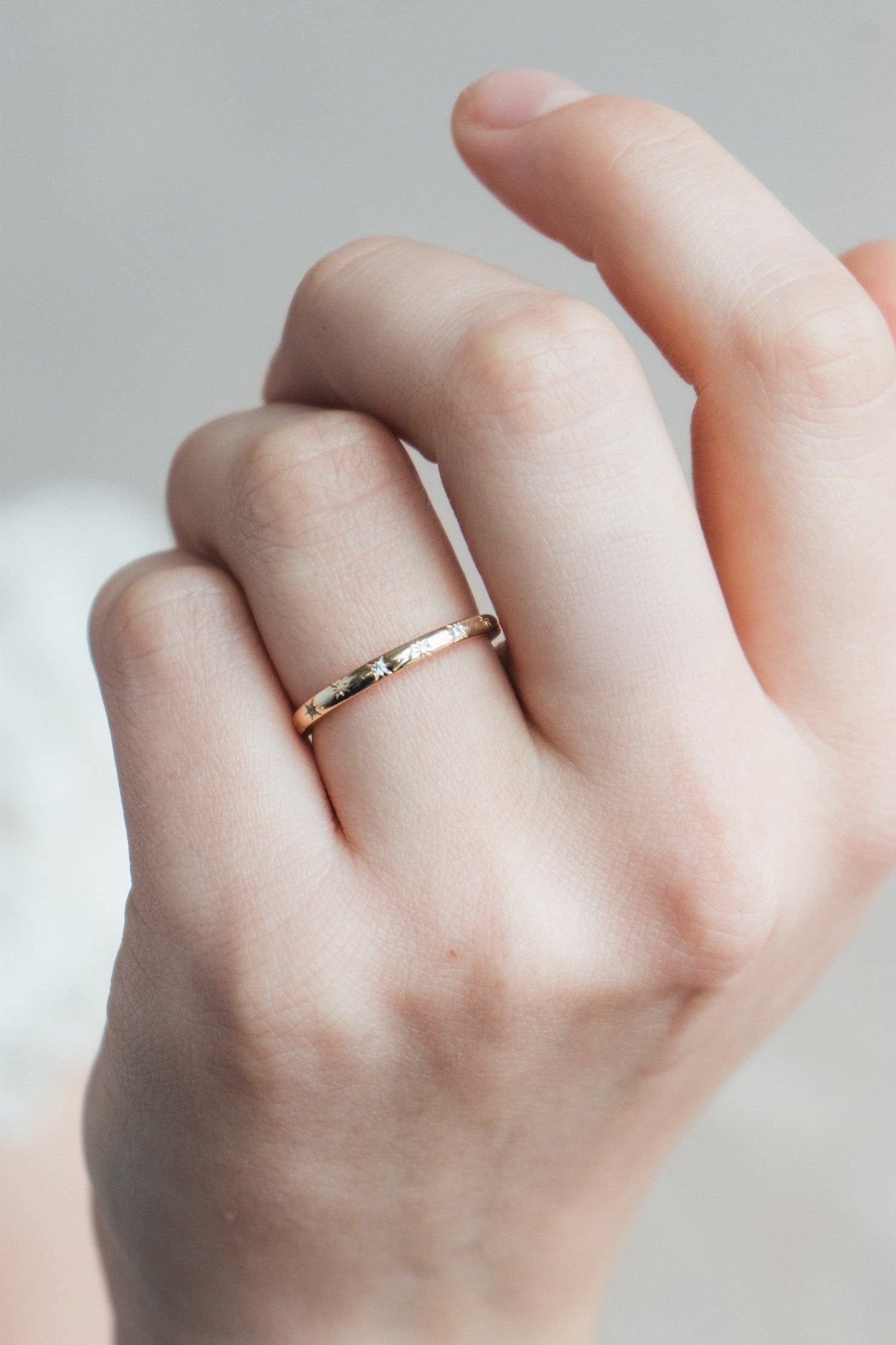 Ring with starburst engravings, celestial jewelry by LIRAE.