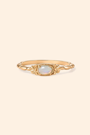 Gold vintage-inspired floral ring with oval opal center stone