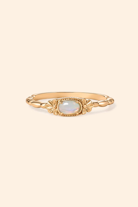Gold vintage-inspired floral ring with oval opal center stone