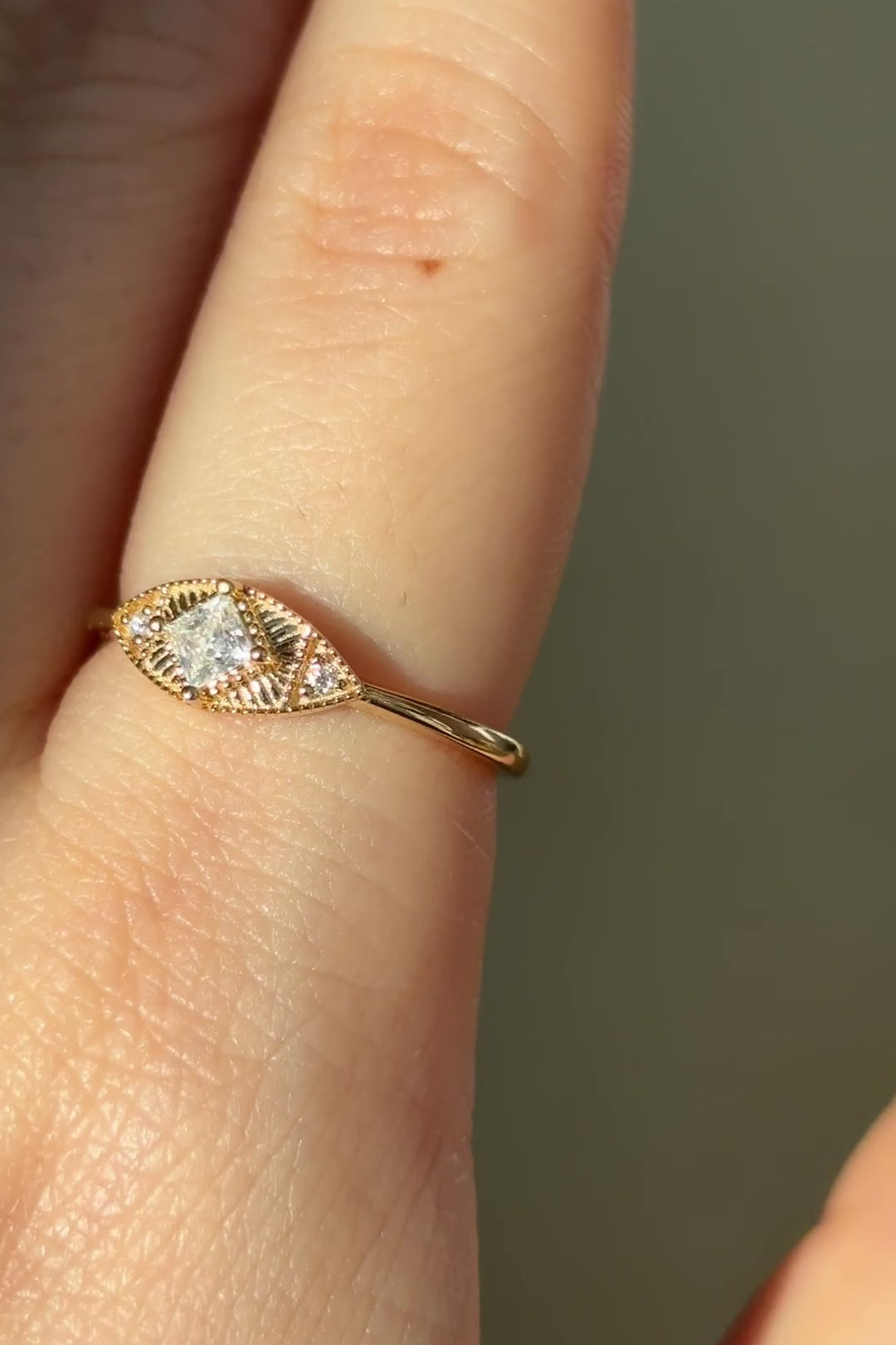 LIRAE vintage-inspired gold ring featuring a square-cut moissanite and sunburst radiant texture, geometric Art Deco jewelry for women.